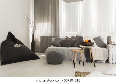 Little And Cosy Room With Grey Curtains, Sofa And Carpet