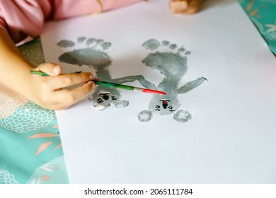 Little creative toddler girl painting and finger colors koala bear  Active child having fun and drawing animals at home  in kindergaten preschool  Education   distance learning for children