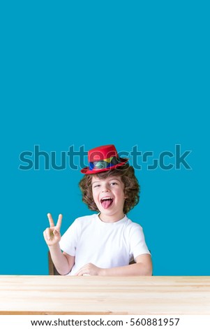 Similar – funny child with clown nose on blue background