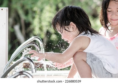 Little  Cute Asian Baby Washing Hand