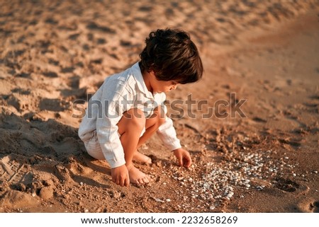 Similar – Foto Bild Baby spielt am Strand.