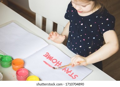 Little Cute Baby Girl Draws At The Table At Home Paints. Early Childhood Development. Quarantine Coronovirus. People Stay Home