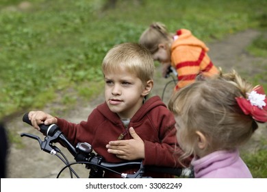 Little Cute Boy At Bycicle