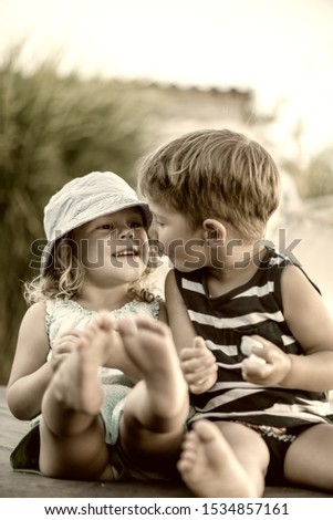 Similar – Two children laughing while playing in the playground.