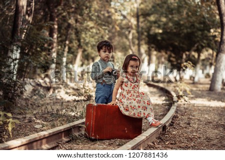 Similar – Mother with her seven year old daughter laughing in a cabin in the countryside