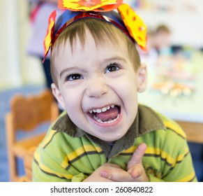 Little cute boy having birthday party at kindergarden