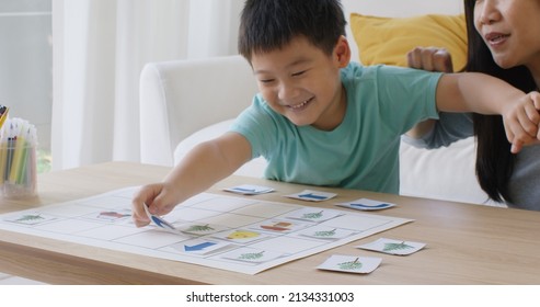 Little Cute Boy Son Enjoy Fun Learn Offline Class Computer Language Game Unplugged Coding Computing STEM STEAM With Mom. Asia Pupil Kindergarten Gen Z Smart Small Kids Smile Play At Table Home Sofa.