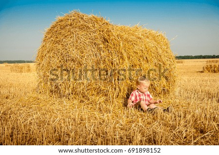 Similar – Vater und Sohn auf dem Feld liegend