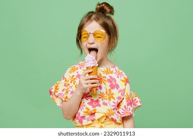 Little cute child kid girl 6-7 years old wearing casual clothes sunglasses eat icecream have fun isolated on plain pastel green background studio portrait. Mother's Day love family lifestyle concept - Shutterstock ID 2329011913