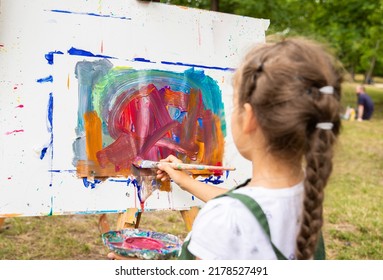 Little Cute Girl Draws A Picture With Acrylic Paints, Art Therapy, Children's Creativity.