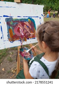 Little Cute Girl Draws A Picture With Acrylic Paints, Art Therapy, Children's Creativity.