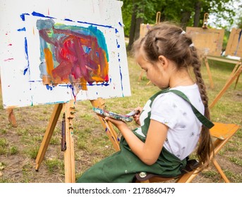 Little Cute Girl Draws A Picture With Acrylic Paints, Art Therapy, Children's Creativity.