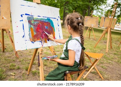 Little Cute Girl Draws A Picture With Acrylic Paints, Art Therapy, Children's Creativity.