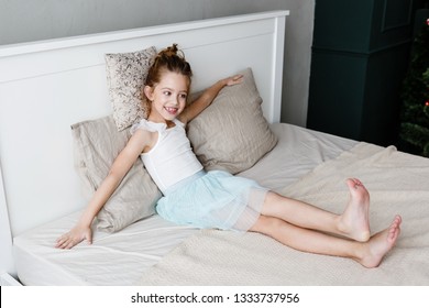 Little Cute Girl Is Lying On The Bed