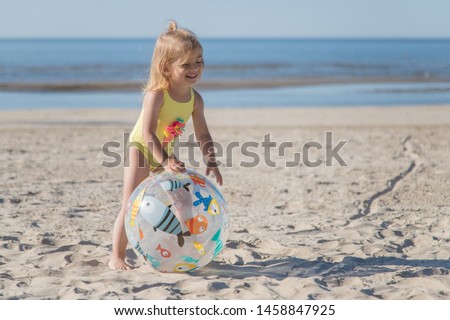 Similar – Girl and senior woman playing on the beach