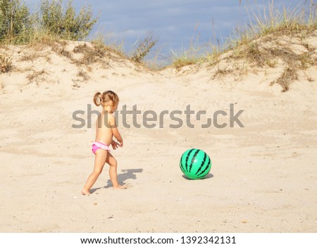 Similar – Girl and senior woman playing on the beach