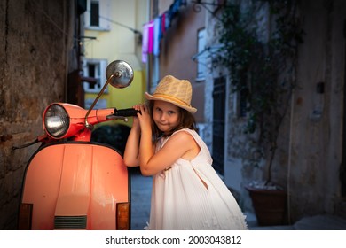Little cute girl  posing in the street of Rovinj, Croatia.