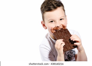 Little Cute Kid Eating Chocolate