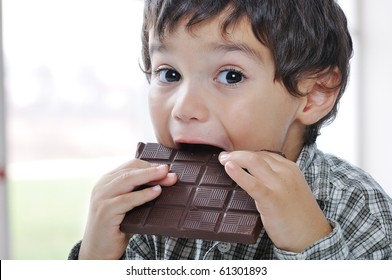 Little Cute Kid Eating Chocolate