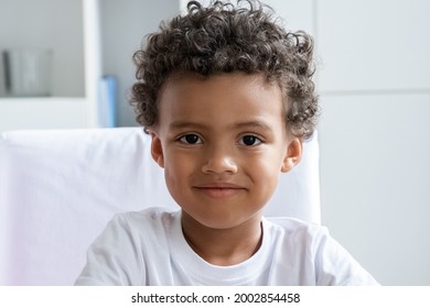 Little Cute Smiling African American Boy Child Looking At Camera. Closeup Face Portrait Of Small Black Male Kid Preschool Age. Happy Childhood, Adoption And Positive Children Emotion Concept