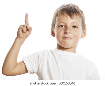 little cute white boy pointing in studio isolated close up