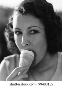 A Little Dab On The Nose Will Do Ya' As A Young Woman Eats Ice Cream From A Cone