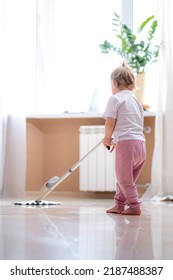 Little Daughter Cleaning In The House, Child Dusting, Cute Little Helper Girl Washing Floor With Mop, Happy Family Cleans The Room.