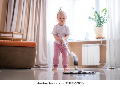 Little Daughter Cleaning In The House, Child Dusting, Cute Little Helper Girl Washing Floor With Mop, Happy Family Cleans The Room.