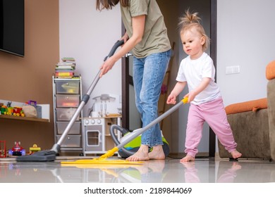 Little Daughter Cleaning In The House, Child Dusting, Cute Little Helper Girl Washing Floor With Mop, Happy Family Cleans The Room.