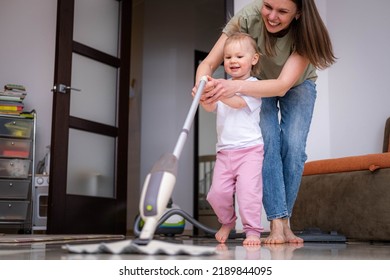 Little Daughter Cleaning In The House, Child Dusting, Cute Little Helper Girl Washing Floor With Mop, Happy Family Cleans The Room.