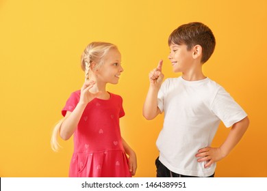 Little Deaf Mute Children Using Sign Language On Color Background