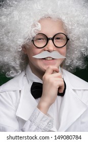 Little Einstein. Cheerful Little Boy Looking Like Einstein And Standing Isolated On Black