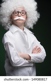 Little Einstein. Confident Little Boy Looking Like Einstein And Standing Isolated On Black