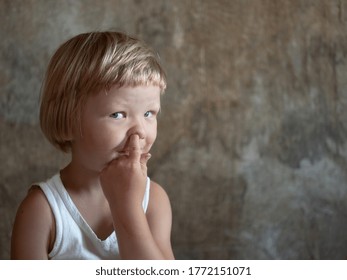 Little Fair-haired Boy Is Smeared With Blood. Baby Has Weak Vessels In Nose Bursting With Pressure Drops And Changes In Weather. Hemophilia Disease. Blond Child Lifts His Head To Stop The Bleeding