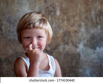 Little Fair-haired Boy Is Smeared With Blood. Baby Has Weak Vessels In Nose Bursting With Pressure Drops And Changes In Weather. Hemophilia Disease. Blond Child Lifts His Head To Stop The Bleeding