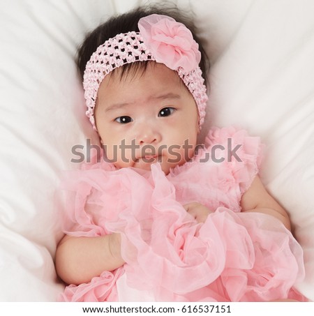 Little Fairy Baby Asian Girl With Pink Tutu Skirts on white bed