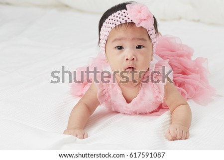 Little Fairy Baby Asian Girl With Pink Tutu Skirts on white bed