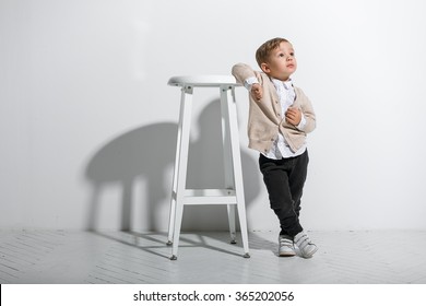 Little fashionable boy. Isolated on white background - Shutterstock ID 365202056