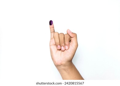The little finger of a man's hand with blue ink patches isolated on a white background. blue ink spots from the fingers of Indonesia's presidential election (presidential election).