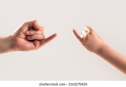 Women and man hands hook pinky fingers together to promise,Loving