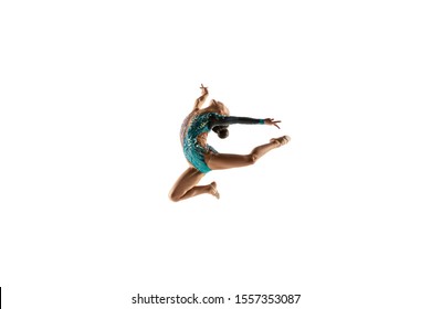 Little flexible girl isolated on white studio background. Little female model as a rhythmic gymnastics artist in bright leotard. Grace in motion, action and sport. Doing exercises in flexibility. - Powered by Shutterstock