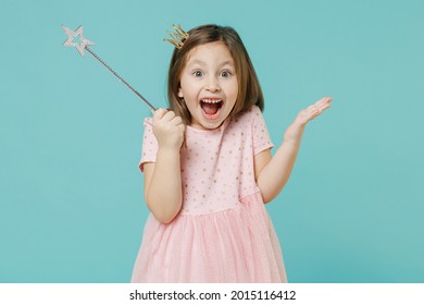 Little fun kid girl princess 5-6 years old wears pink dress crown diadem hold magic wand fairy stick isolated on pastel blue color background child studio. Mother's Day love family lifestyle concept - Powered by Shutterstock