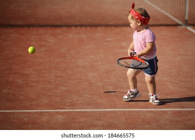 little funny girl plays tennis