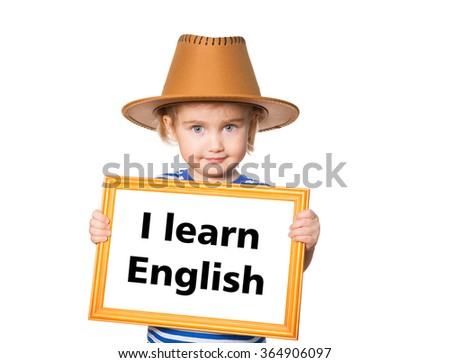 Little Funny girl in striped shirt with blackboard. Text  I learn english.  Isolated on white background