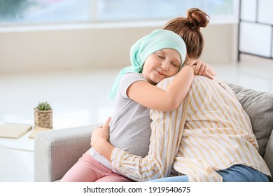Little girl after chemotherapy with her mother at home - Shutterstock ID 1919540675