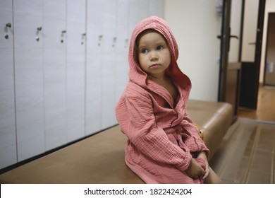 Little Girl After Spa In A Dressing Gown In A Locker Room