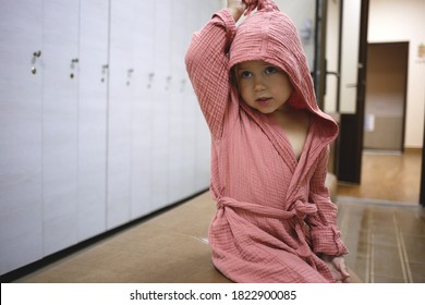 Little Girl After Spa In A Dressing Gown In A Locker Room