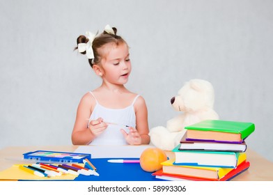 little girl with the appurtenances to school - Shutterstock ID 58993306