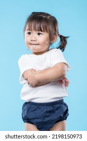 Little girl arm cross over blue background - Shutterstock ID 2198150973