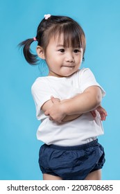 Little girl arm cross over blue background - Shutterstock ID 2208708685